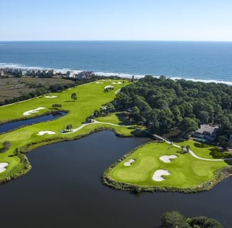 aerial view of a golf course close to the beach
