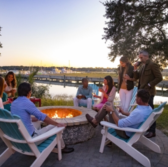 group of people around a firepit