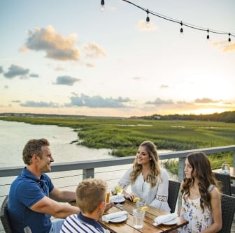 family eating by the water