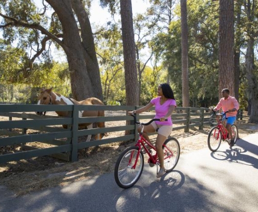 women and man biking